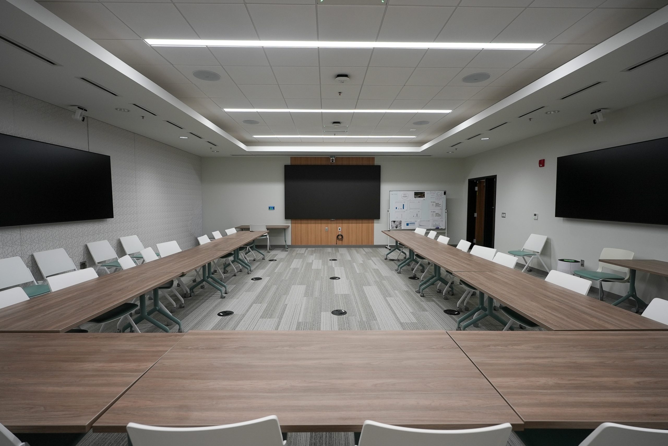 Nexstar boardroom featuring display deployment and hybrid conferencing audio-visual integration by Ramcom.
